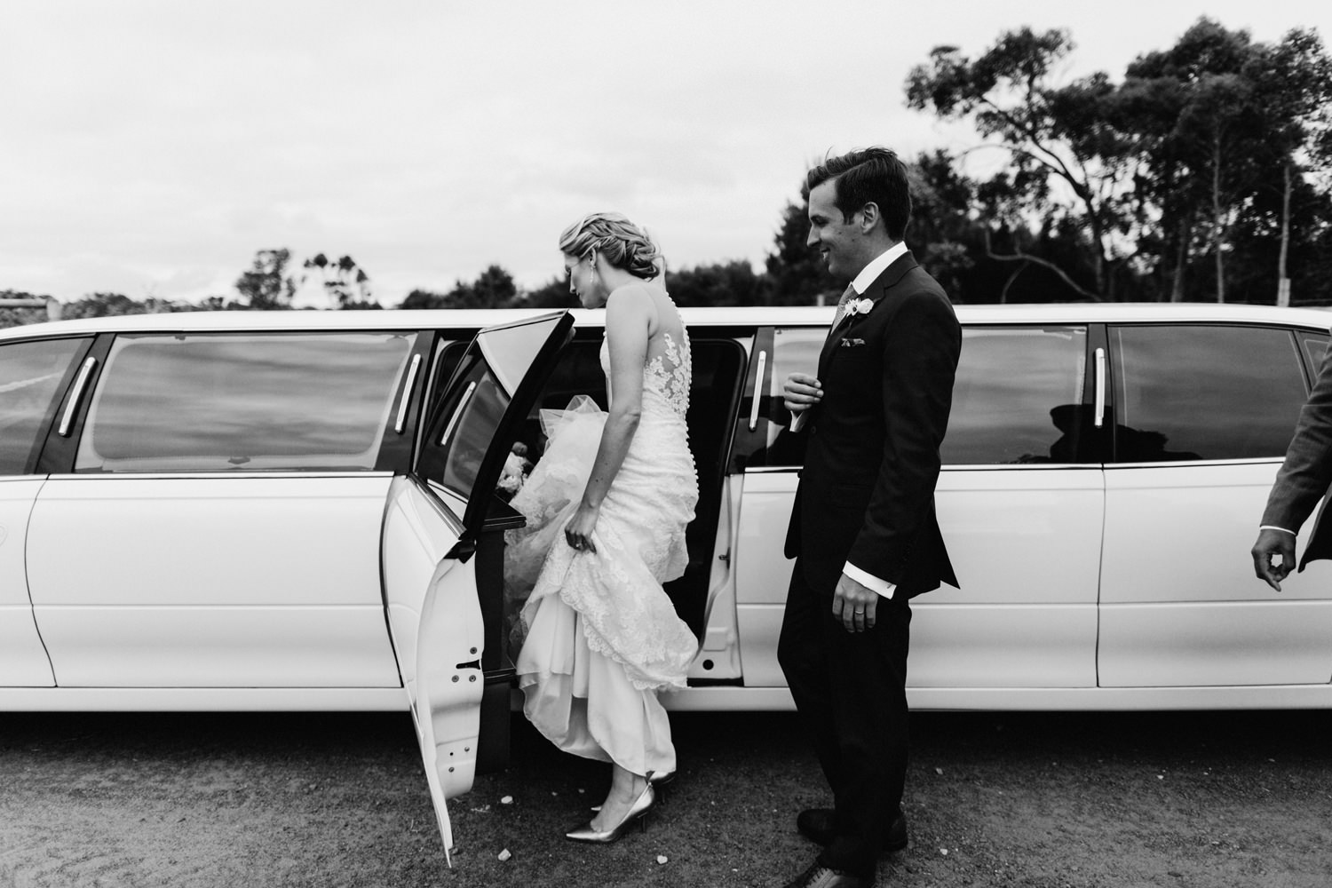 bride getting into limousine at wills domain 
