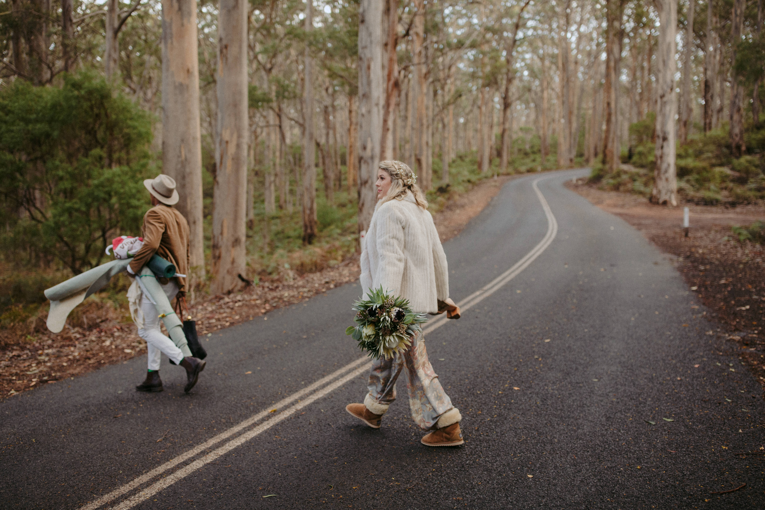 bride walking into boranup forest in ugg boots