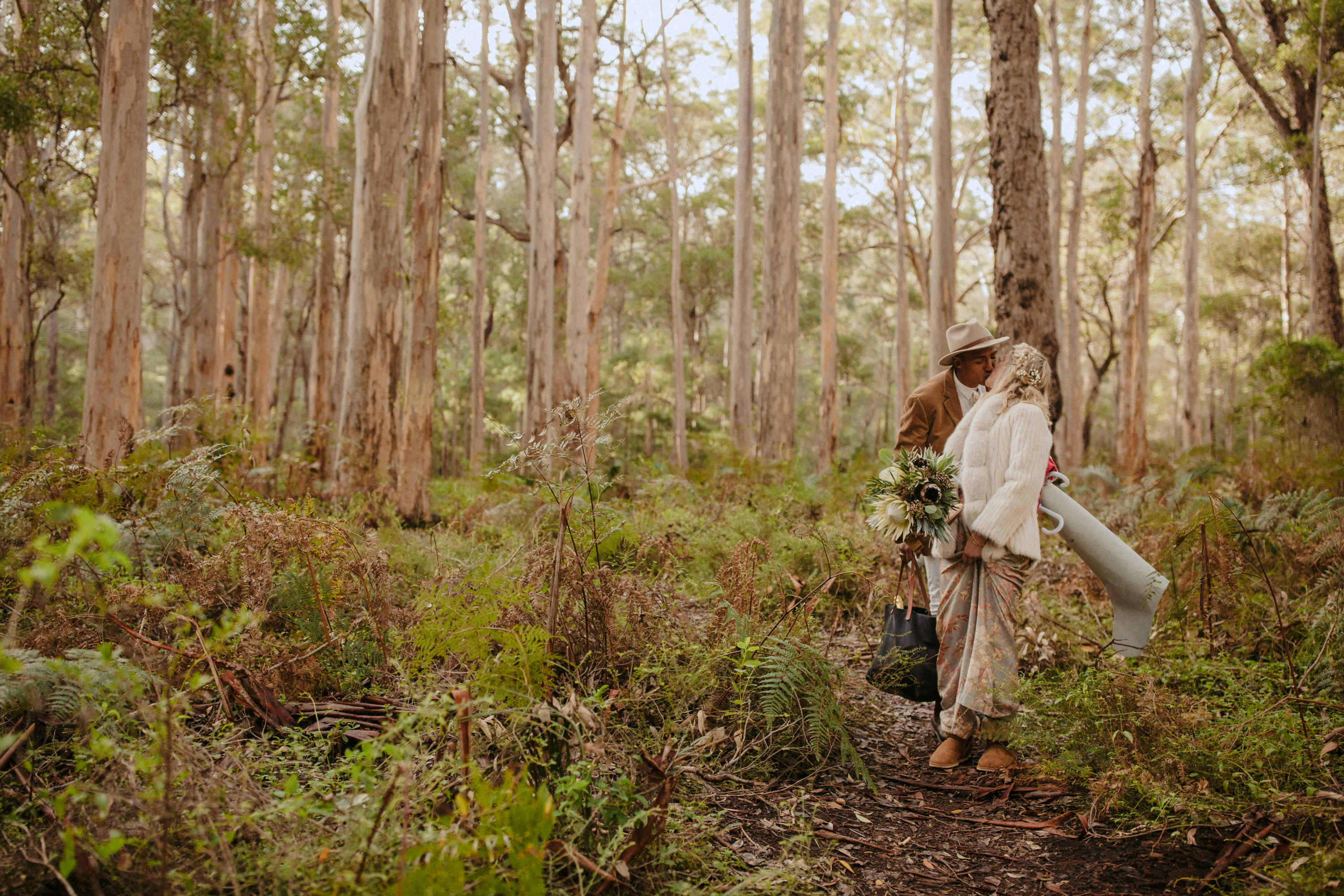 elopement couple kissing in boranup forest